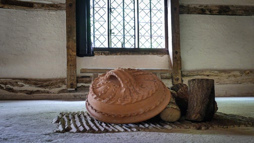 View of the curfew in the historic fireplace in the medieval hall at Alfriston Clergy House